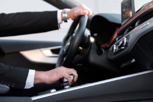 driver-dressed-elegant-costume_23-2149184284